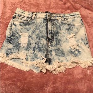 Washed out, ripped high waisted short